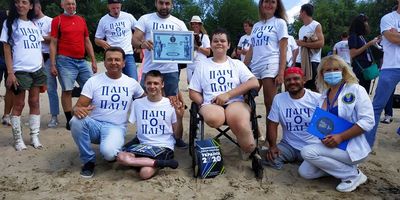 16-річний маріуполець, який втратив ноги і руку, переплив Дніпро і встановив рекорд України